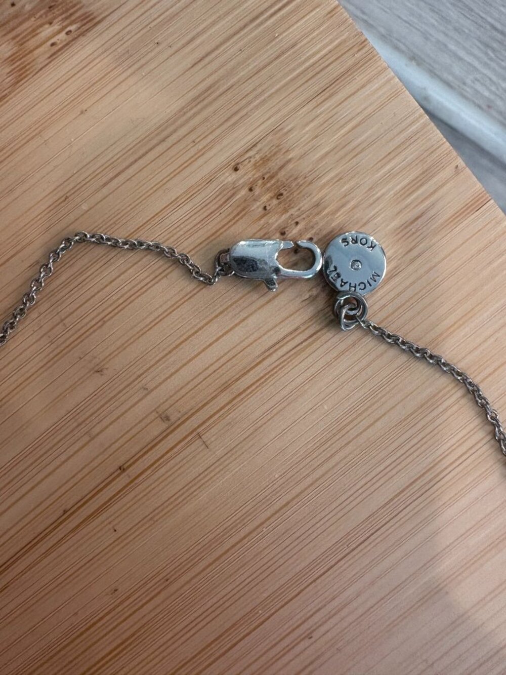 Michael Kors Silver Tone Pavé Heart MK Necklace - Picture 3 of 4